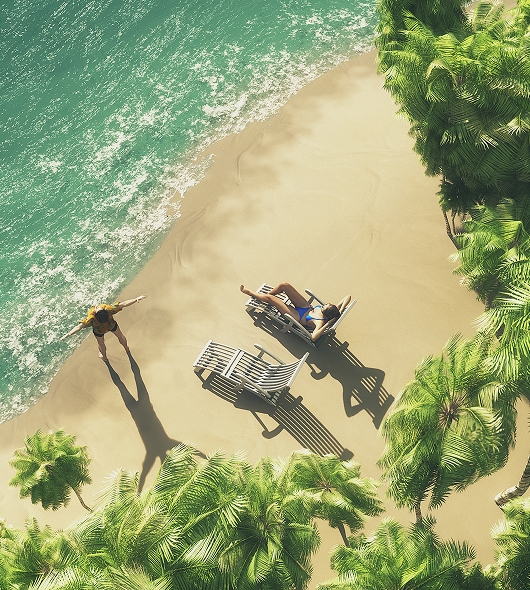 Un homme et une femme sur des transats sur une plage vue de haut