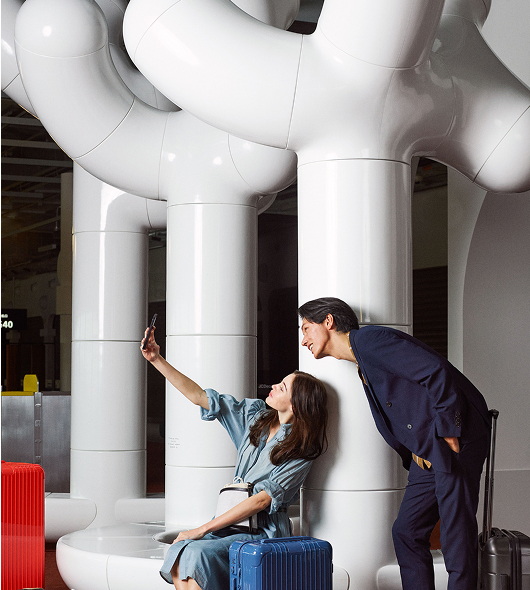 Couple of passengers in front of Les Simonnet sculptures in the Extime boarding lounge, Terminal 2G, Paris-Charles de Gaulle